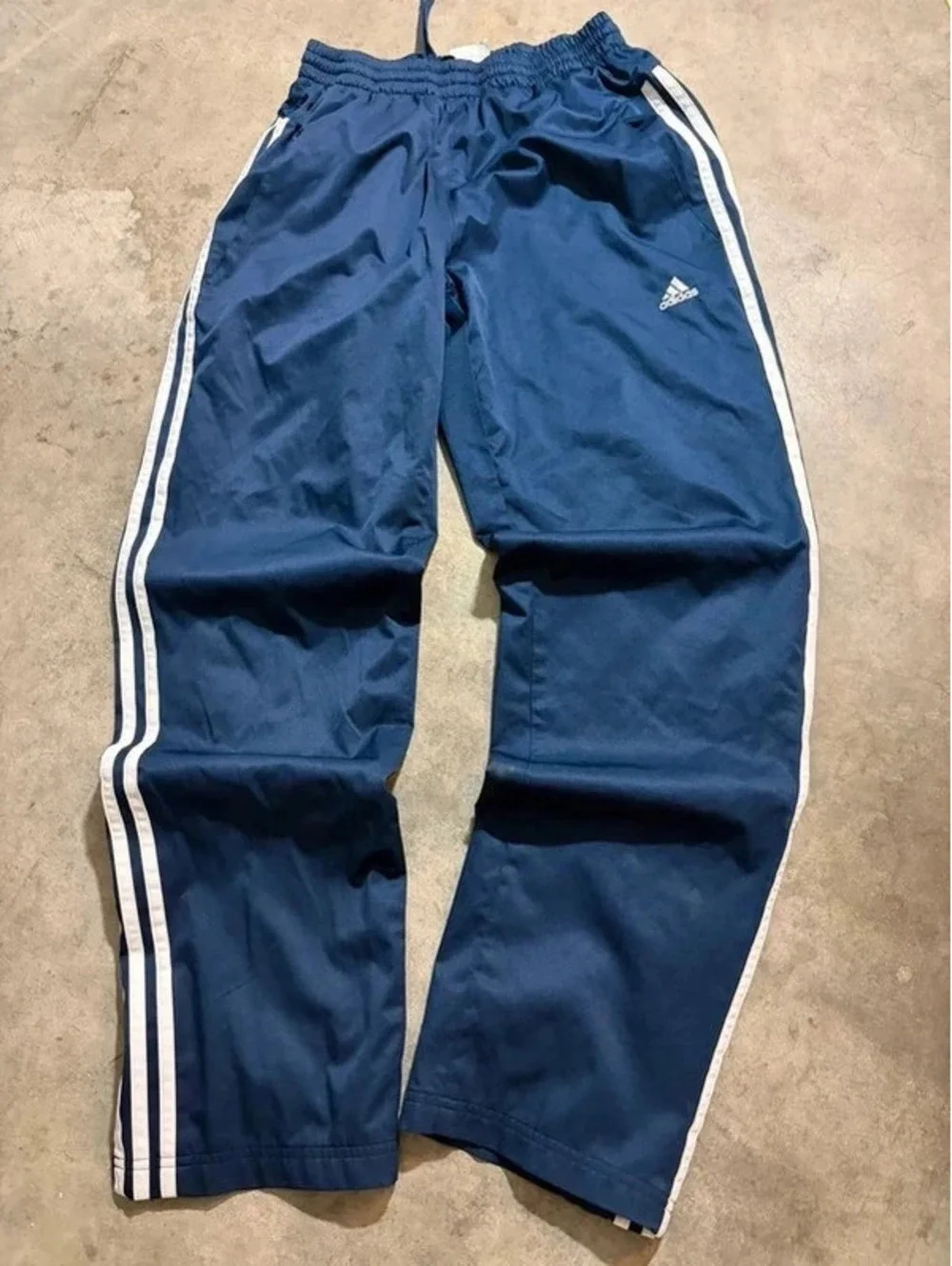 Y2K vintage blue and white striped adidas track pants with zipper on ankle